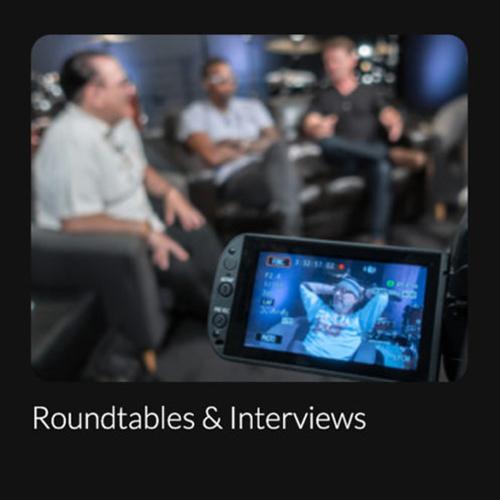 DC-Entertainment _ Interviews Image of four guys being filmed and sitting in couches for a roundtable interview.