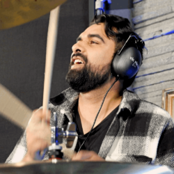 Image of Kai Rodriguez playing drums